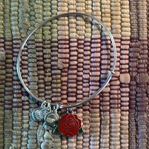Alex and Ani silver colored bracelet with rose charm